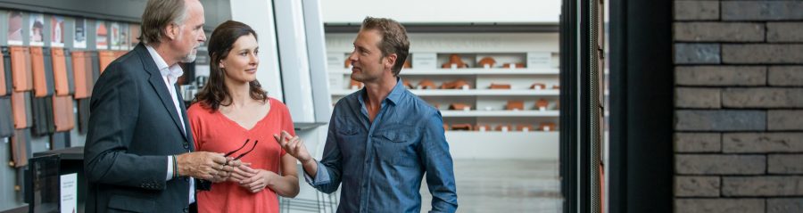Couple with architect in showroom Londerzeel